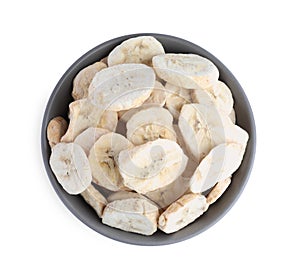 Freeze dried bananas in bowl on white background, top view
