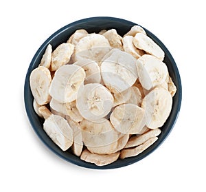 Freeze dried bananas in bowl on white background, top view