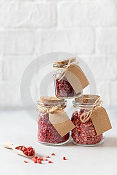 Freeze dried berries and fruits in glass jars. Side view, copy space