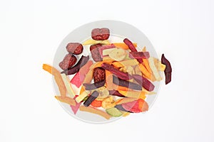 Freeze dried colorful crispy fruits and vegetables over white background. Mixed dry food for health. Top view