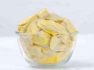 Freeze-dried durian, is a processed fruit that retains the nutritional value of food. Freeze-dried durian in glass bowl isolated