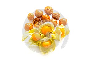 Freeze dried and fresh physalis on a white background.