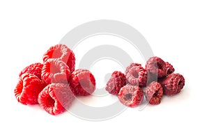 Freeze dried and fresh raspberries on a white background.