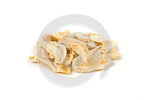Freeze dried mango slices in a heap isolated over white