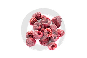 Freeze dried raspberries on a white background.