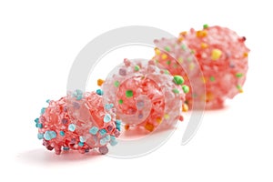 Freeze Dried Sweet and Tangy Candy with Small Candies on the Outside of a Chewy Center Isolated on a White Background