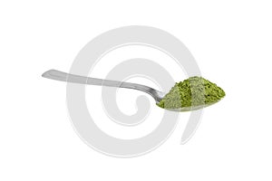 Freeze dried young organic wheatgrass powder teaspoon isolated on white