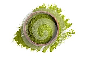 Freeze dried young organic wheatgrass powder in wooden bowl isolated on white photo