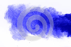 Freeze motion of blue dust explosion isolated. Blue powder explosion on white background.