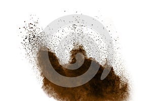 Freeze motion of brown dust explosion. Stopping the movement of brown powder.