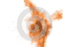 Freeze motion of brown dust explosion. Stopping the movement of brown powder. Explosive brown powder on white background