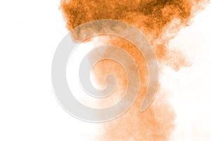 Freeze motion of brown dust explosion. Stopping the movement of brown powder. Explosive brown powder on white background