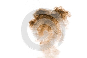 Freeze motion of brown powder exploding. Abstract design of brown dust cloud against white background