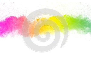 Freeze motion of color particles on white background. Multicolored granule of powder explosion