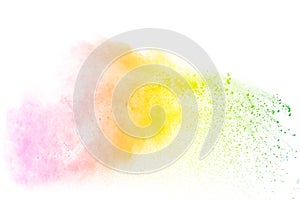 Freeze motion of color particles on white background. Multicolored granule of powder explosion