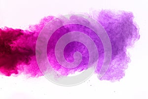 Freeze motion of colorful dust explosion isolated. colored powder explosion on white background.