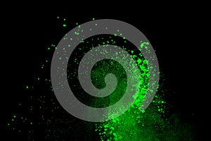 Freeze motion of green powder exploding/throwing green dust