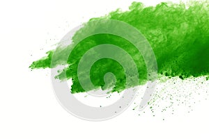 Freeze motion of Green powder exploding on white background.