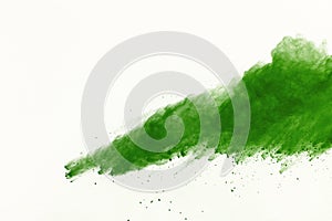 Freeze motion of Green powder exploding on white background.