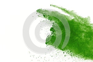 Freeze motion of Green powder exploding on white background.