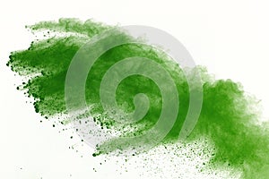 Freeze motion of Green powder exploding on white background.