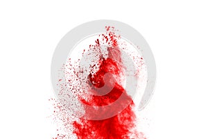 Freeze motion of red powder exploding, isolated on white background.