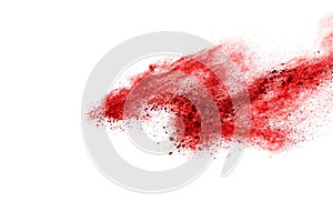 Freeze motion of red powder exploding, isolated on white background.