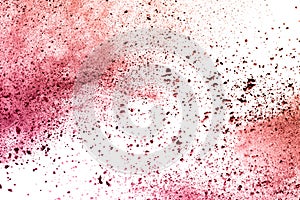 Red powder explosion on white background.