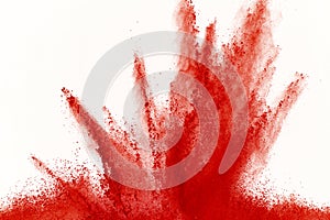 Freeze motion of red powder exploding, isolated on white background. Abstract design of red dust cloud. Particles explosion screen