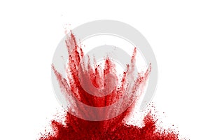 Freeze motion of red powder exploding, isolated on white background. Abstract design of red dust cloud. Particles explosion screen