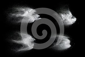 Freeze motion of white dust particles on black background