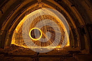 Freezelight using spinning burning steel wool and pyrotechnics