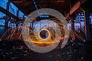 Freezelight by using spinning burning steel wool and pyrotechnics in abandoned unfinished industrial building