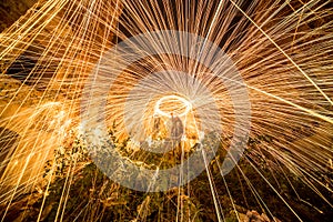 Freezelight using spinning burning steel wool and pyrotechnics in the overgrown ruins.