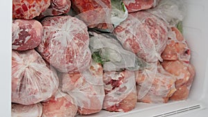 Freezer Filled with Meat and Vegetable Packets Frozen in Plastic Bags Food Reserve Stored for Food Preparation