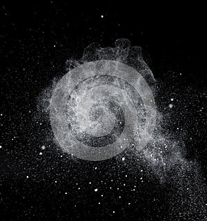 Freezing falling particles or stardust in air on black background for overlay blending mode. Stopping the movement of white powder