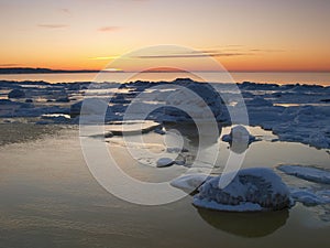 Freezing sea shore in the romantic evening light