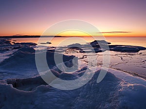 Freezing sea shore in the romantic evening light