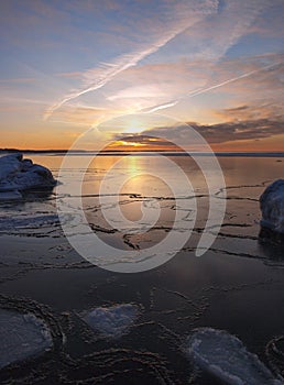 Freezing sea shore in the romantic evening light