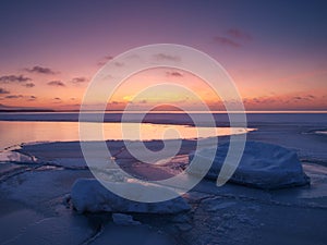 Freezing sea shore in the romantic evening light