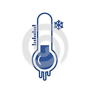 Freezing temperature on blue thermometer with snow sign