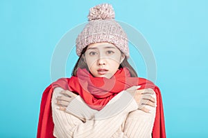 Freezing young woman in winter cloth