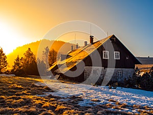 Freezy mountain morning with first beams of rising sun