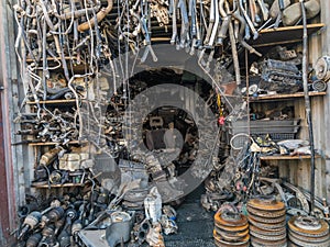 freight container filled with used car parts on junkyard shop