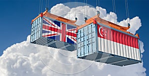 Freight containers with United Kingdom and Singapore national flags.
