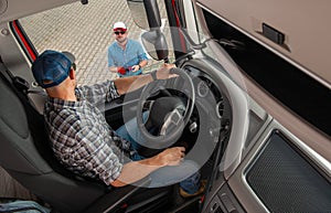 Freight Dispatcher Giving Last Instruction To Semi Truck Driver