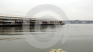 Freight and industrial Pier 94 with warehouses, view from the Hudson River Park on Manhattan`s West Side, NYC