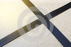 freight parcel with plastic black strap.