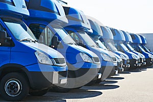 Transporting service company. commercial delivery vans in row