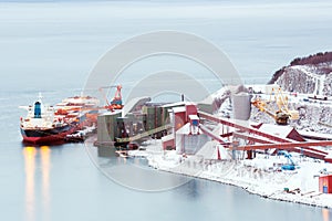 Freight ship at Iron ore mine refinery Factory